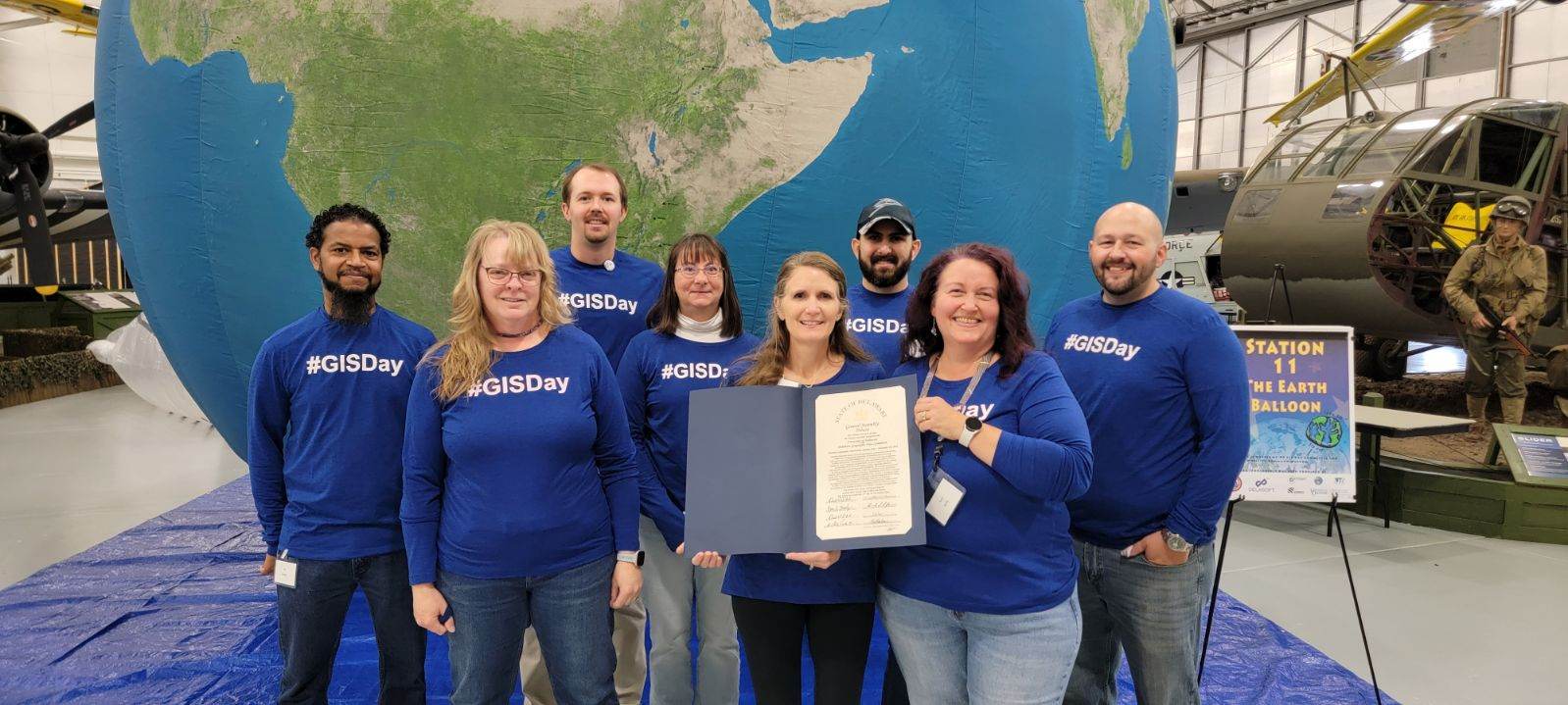 GIS Day Committee holding the GIS Day Proclamation